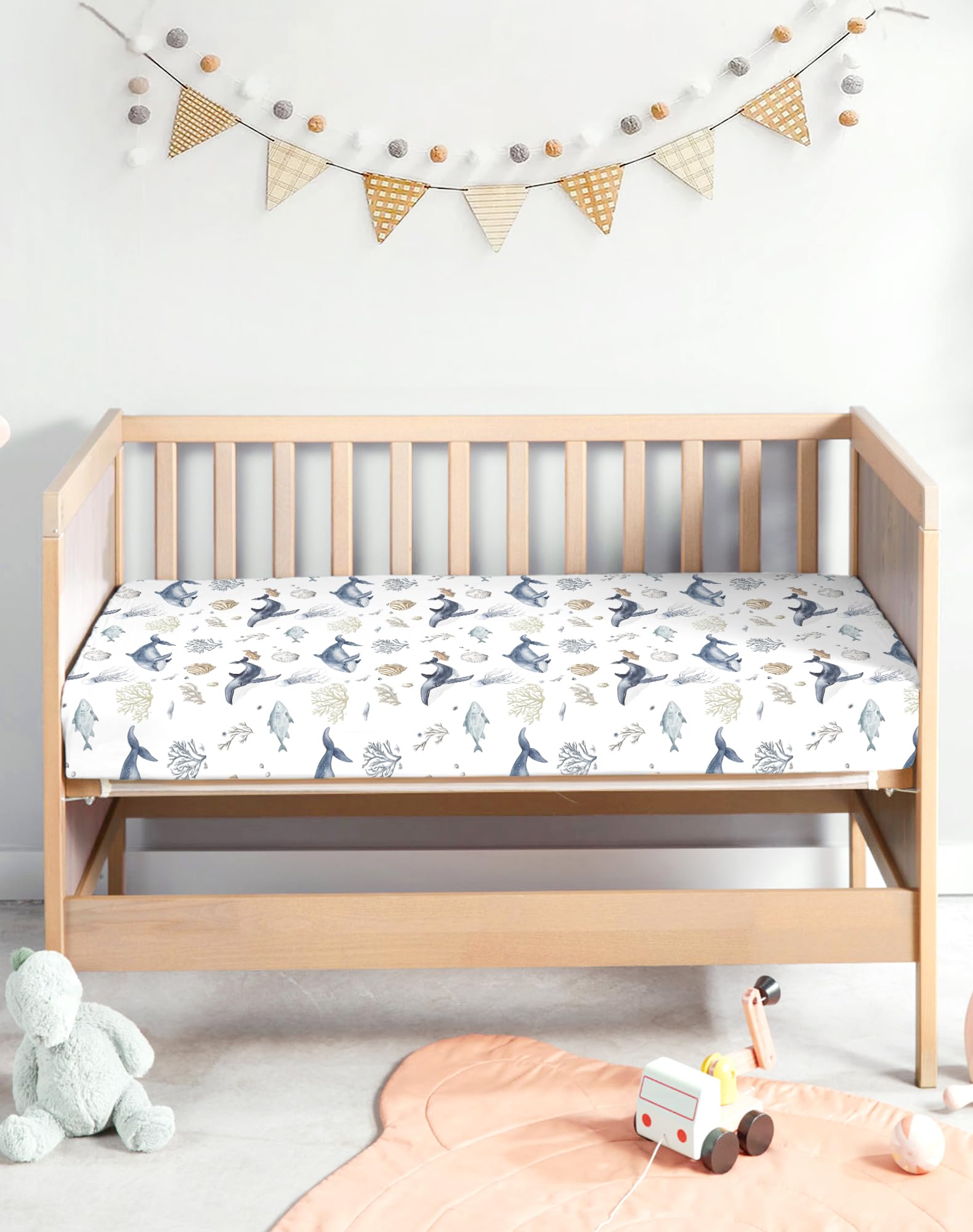 Woodiville Aquatic Adventures crib sheets dryer-friendly ensure quick turnaround after laundry.