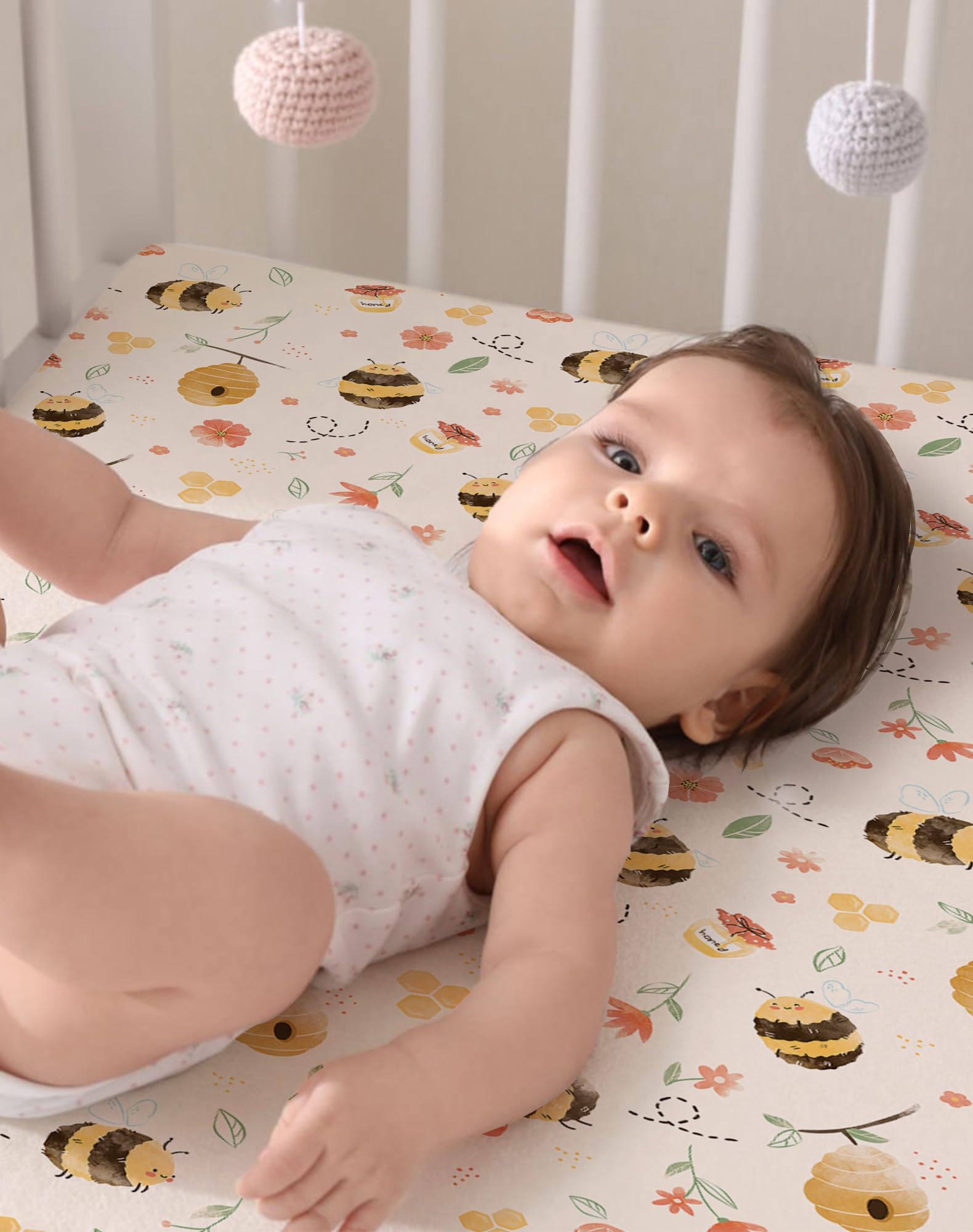 Woodiville Bee Happy elastic-band keeps sheets in place through play.