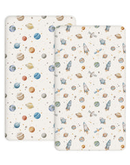 Woodiville Stellar Adventure crib sheet showing snug fit on 28x52 crib mattress with secure edge elastic.
