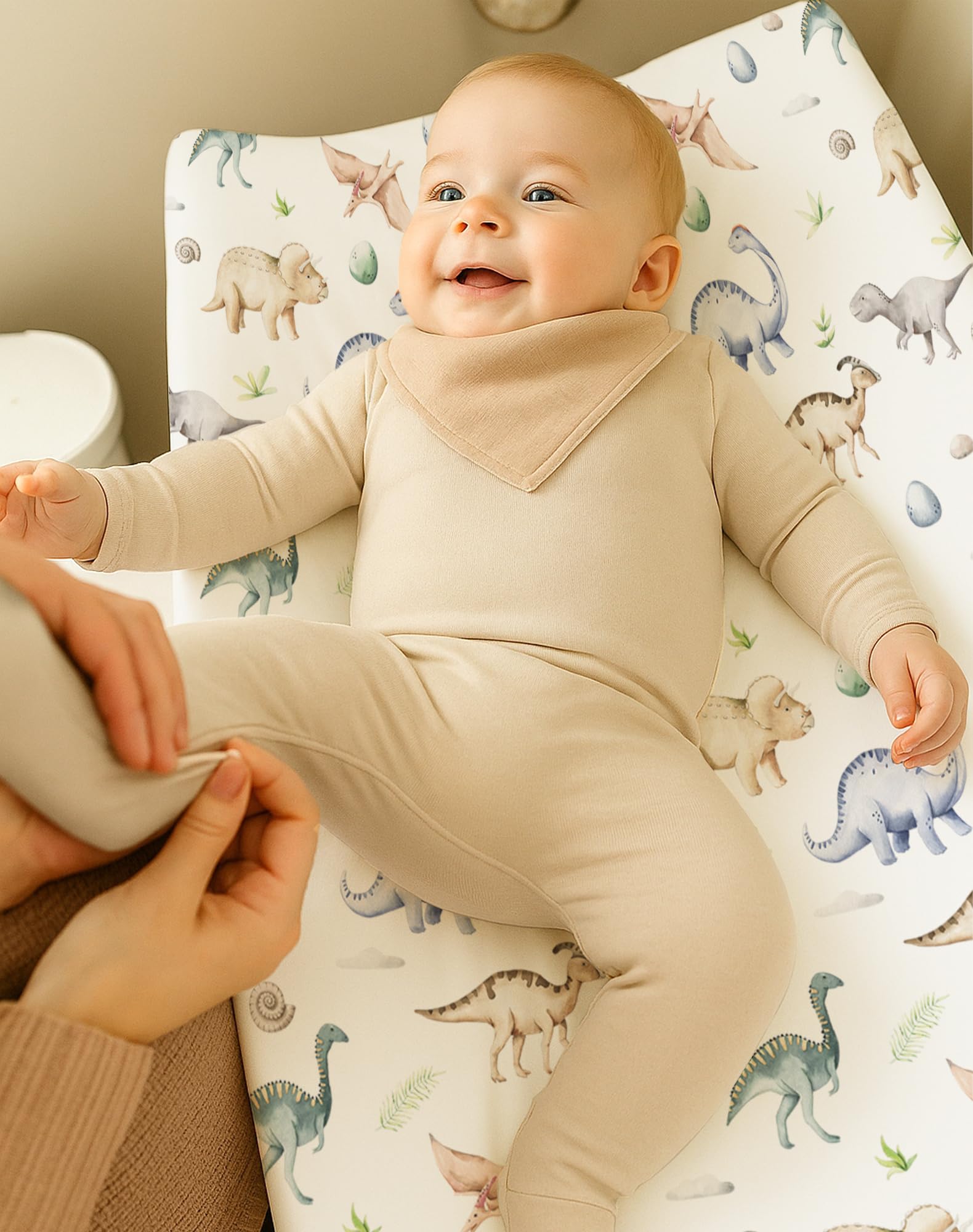 Woodiville Dino Pals cover with 360° elastic demonstrates slip-free fit during wiggly diaper changes
