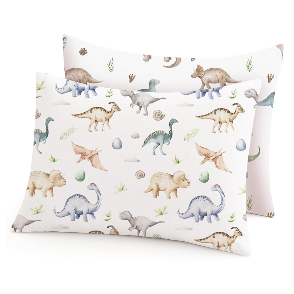 Woodiville Dino Pals pillowcase close-up shows silky fabric for gentle toddler skin during sleep.