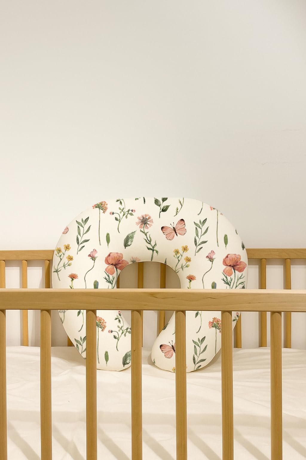 Woodiville neutral-design covers blend with any nursery theme.