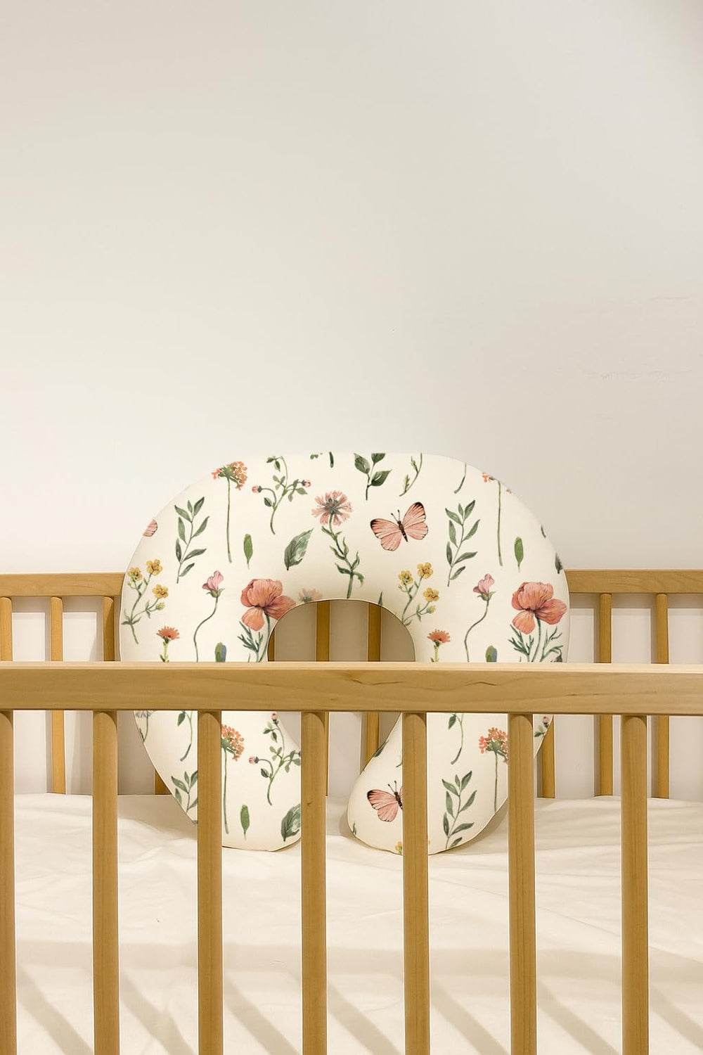 Woodiville neutral-design covers blend with any nursery theme.