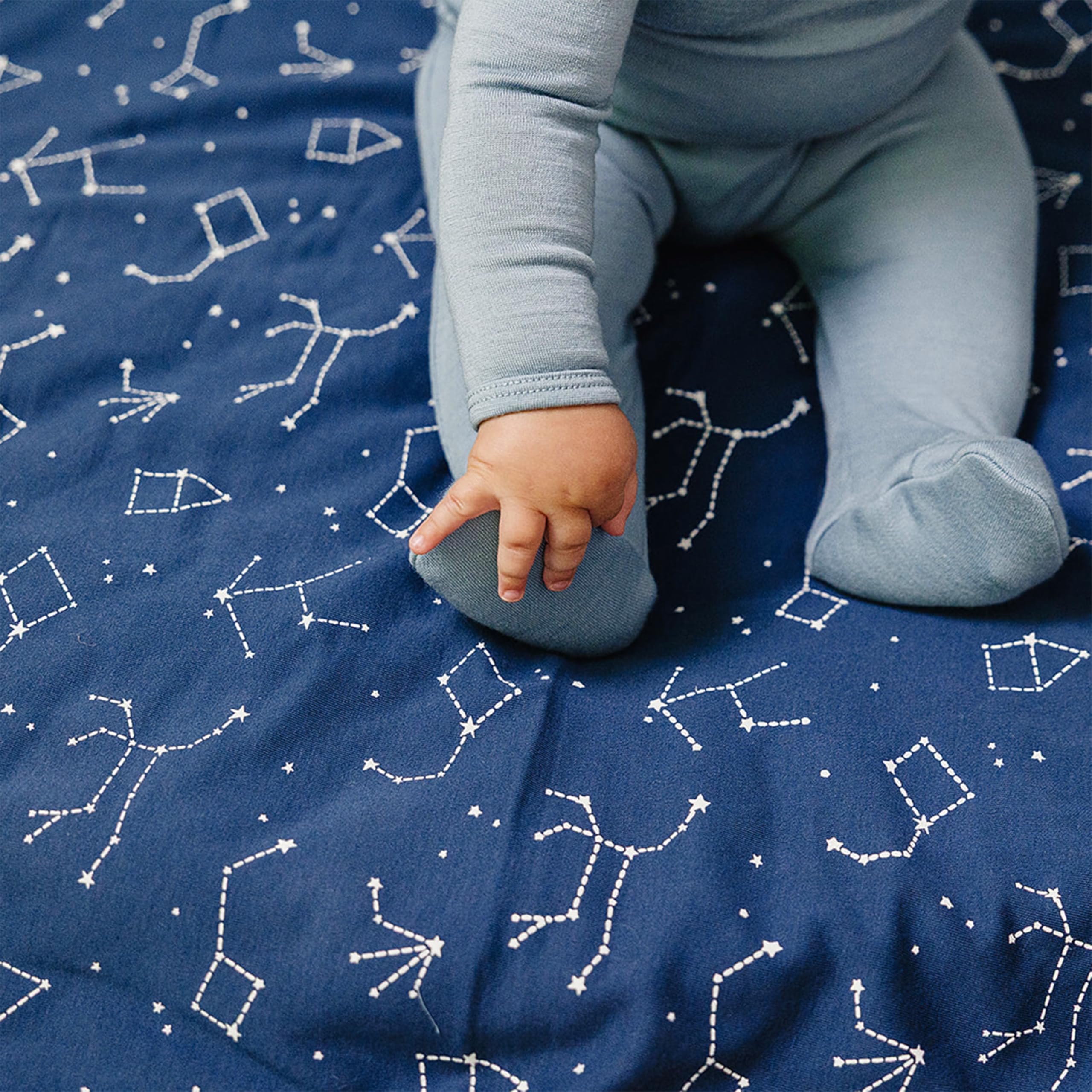 Woolino blanket spread on crib shows generous 40x31.5 inch size.
