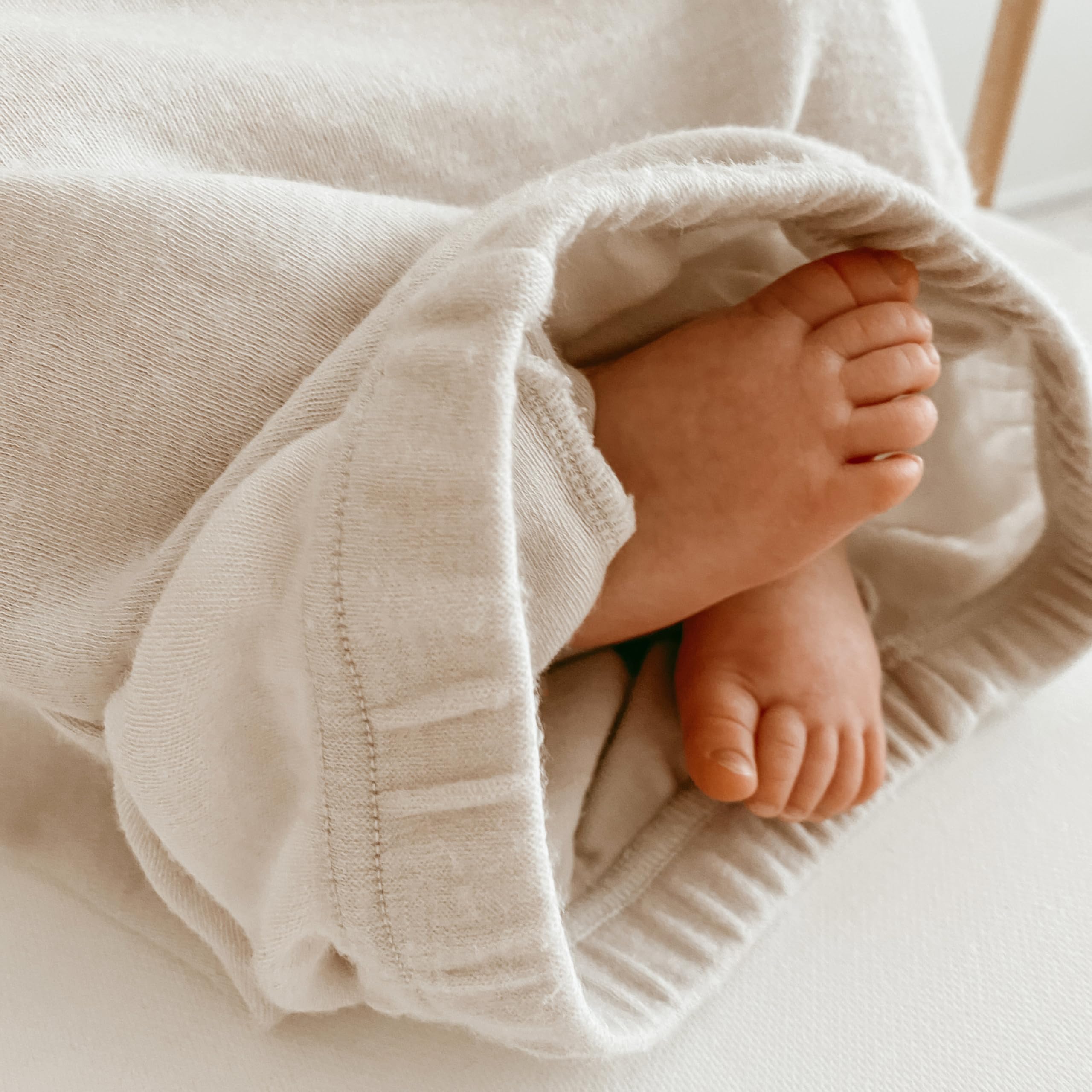 Woolino Infant Nightgown beige color worn by baby for year-round comfort.