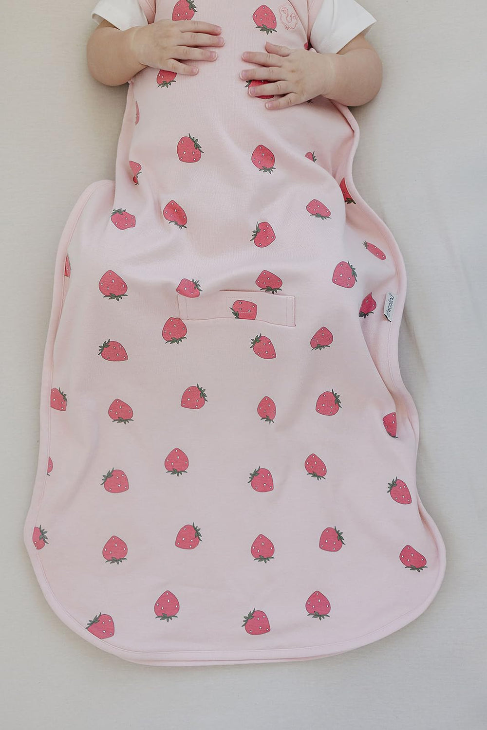 Woolino Merino Sleep Sack strawberry shoulder snaps for secure changes.