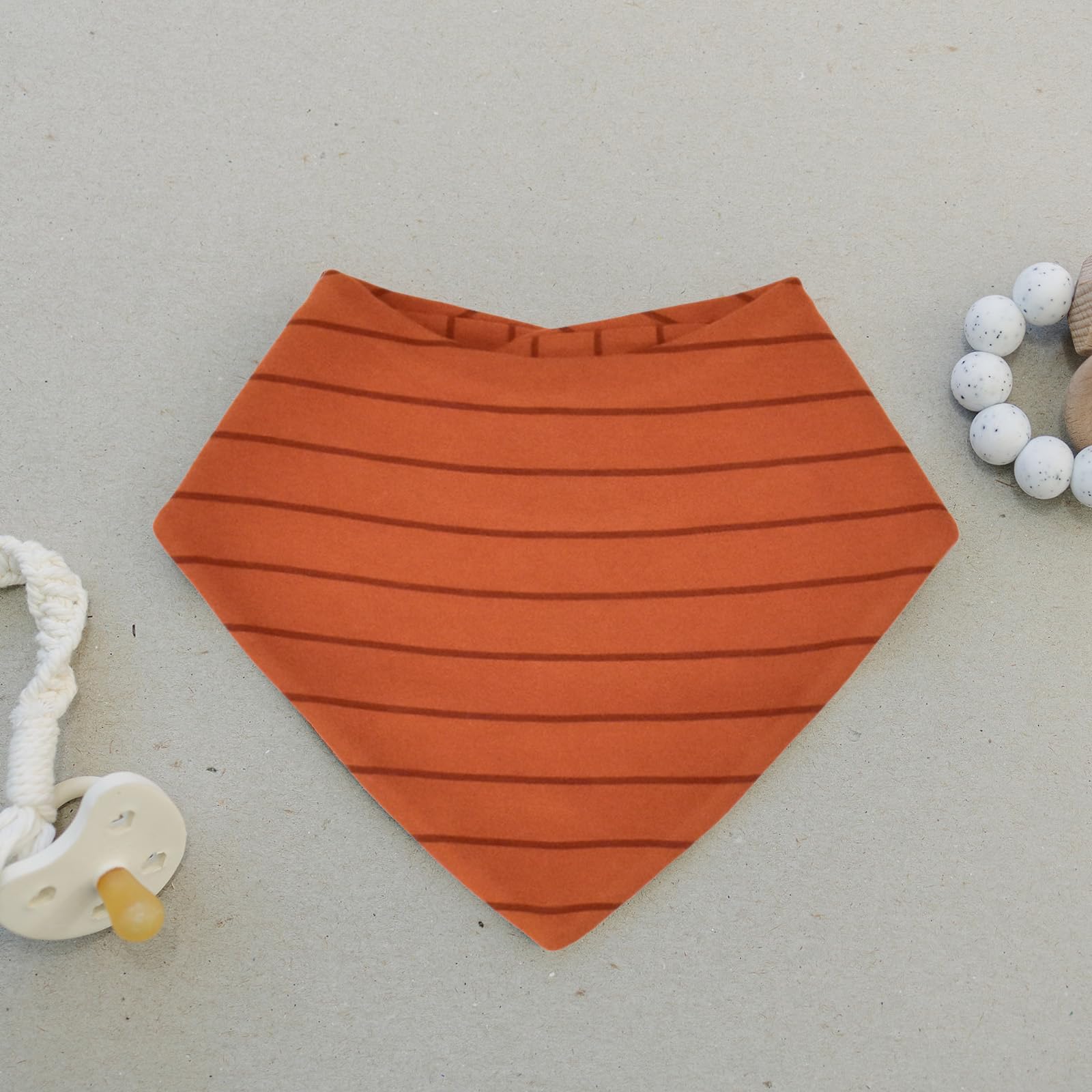 Woolino Merino baby bibs outer cotton layer and inner wool warmth in action.