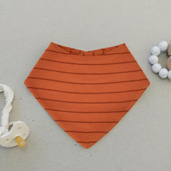 Woolino Merino baby bibs outer cotton layer and inner wool warmth in action.
