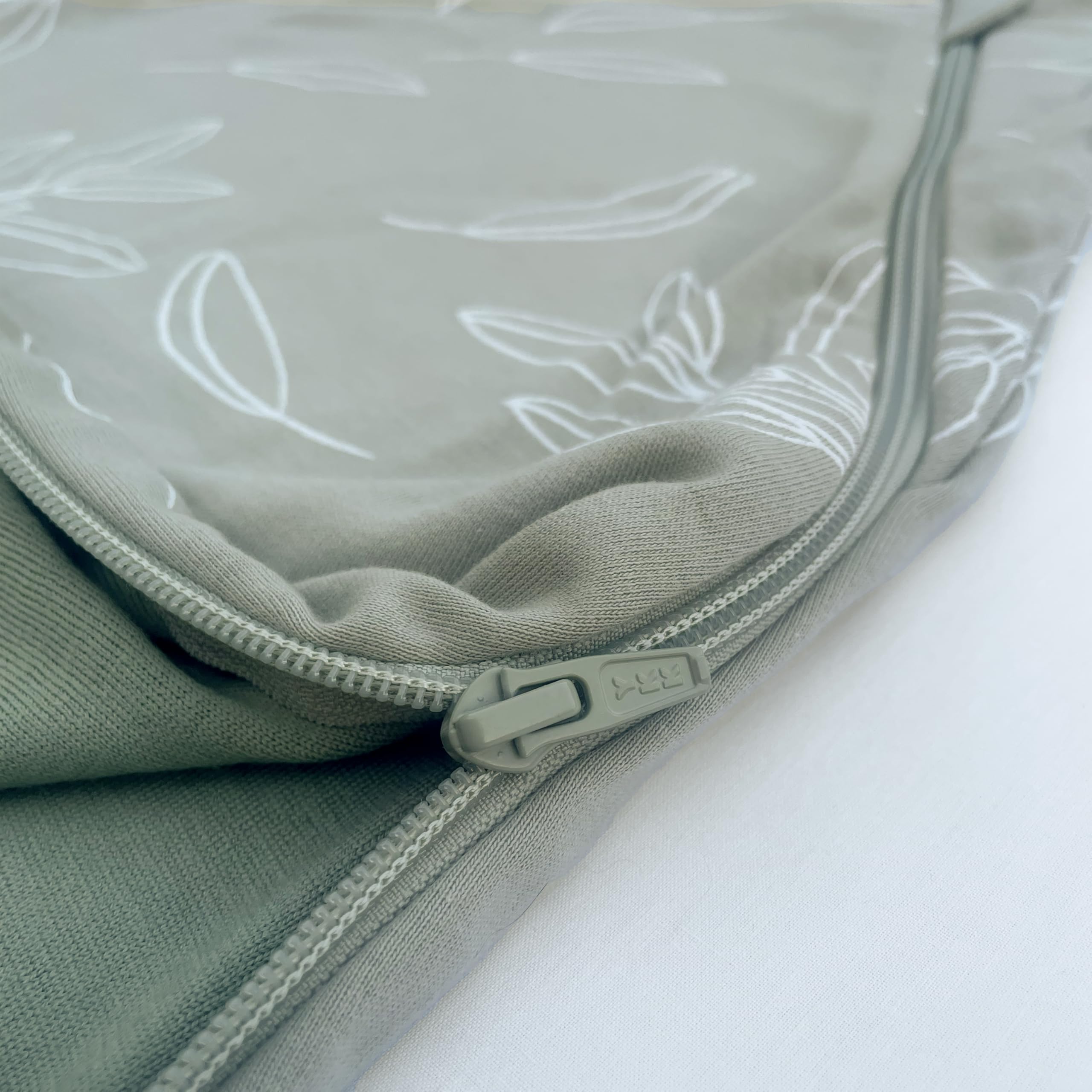 Woolino sleep sack laid flat demonstrates generous sizing from 0 to 6 months.