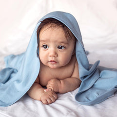 Woolino swaddle blanket blue in stroller use showcases versatility