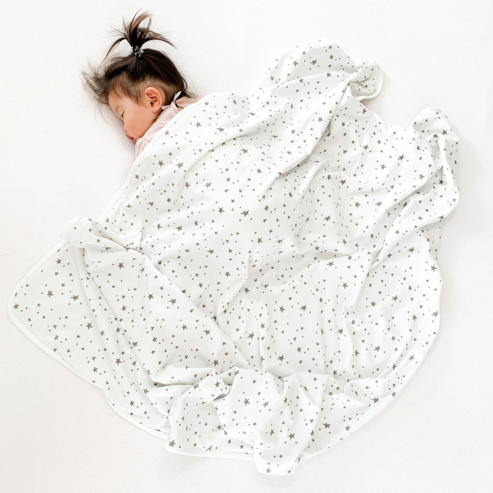 Woolino blanket shows organic cotton outer for a safe, soft surface.