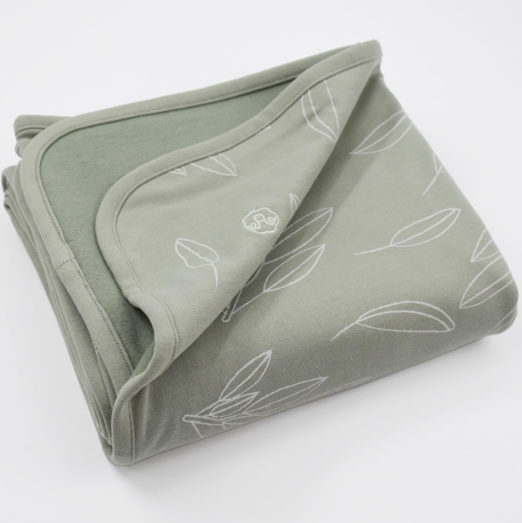 Woolino Toddler Blanket sage-color fabric layered for cozy year-round comfort.