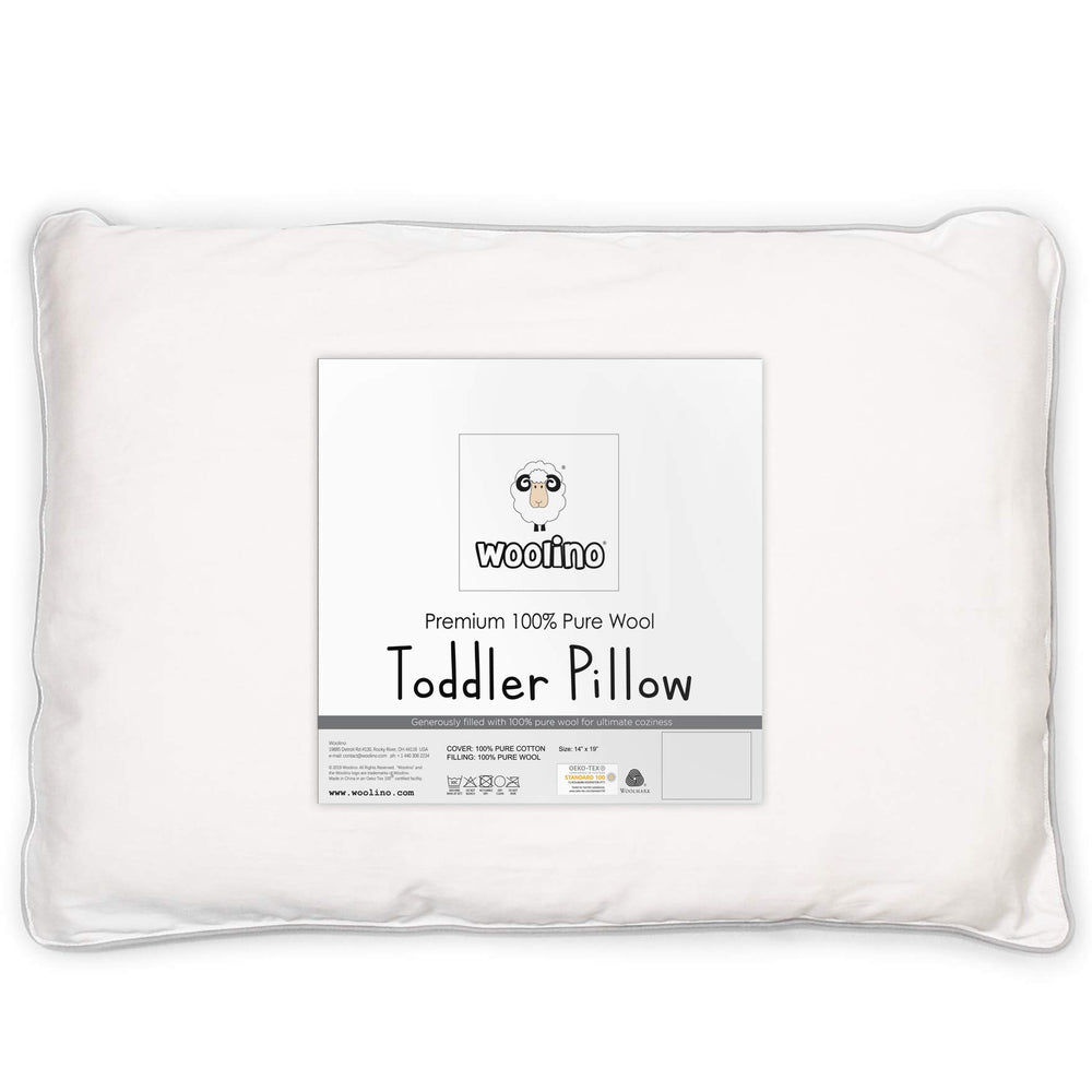 Woolino toddler pillow wool-fill closeup highlights breathable, safe sleep surface.
