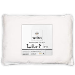Woolino toddler pillow wool-fill closeup highlights breathable, safe sleep surface.