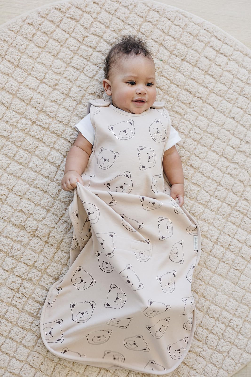 Woolino under-arm snaps grow-with-baby design for longer wear.
