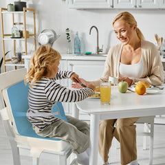 Wooshwa booster seat adjustable straps closeup highlights secure fit for growing toddlers.