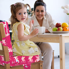 wooshwa unicorn booster seat with adjustable straps secures child safely during meals.
