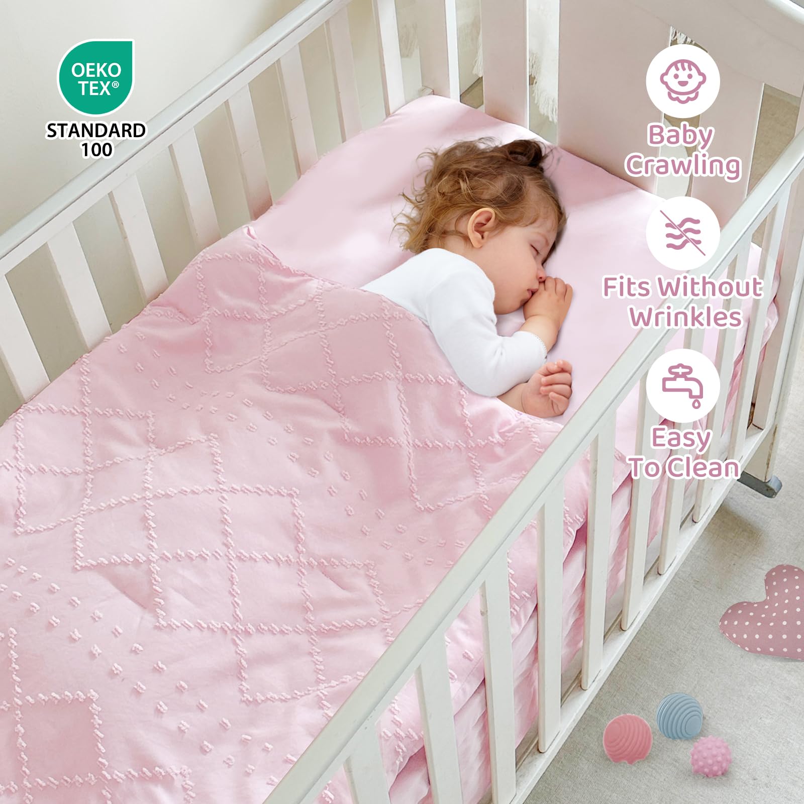 Wowelife mini crib bedding set laid flat with comforter, sheet, and skirt