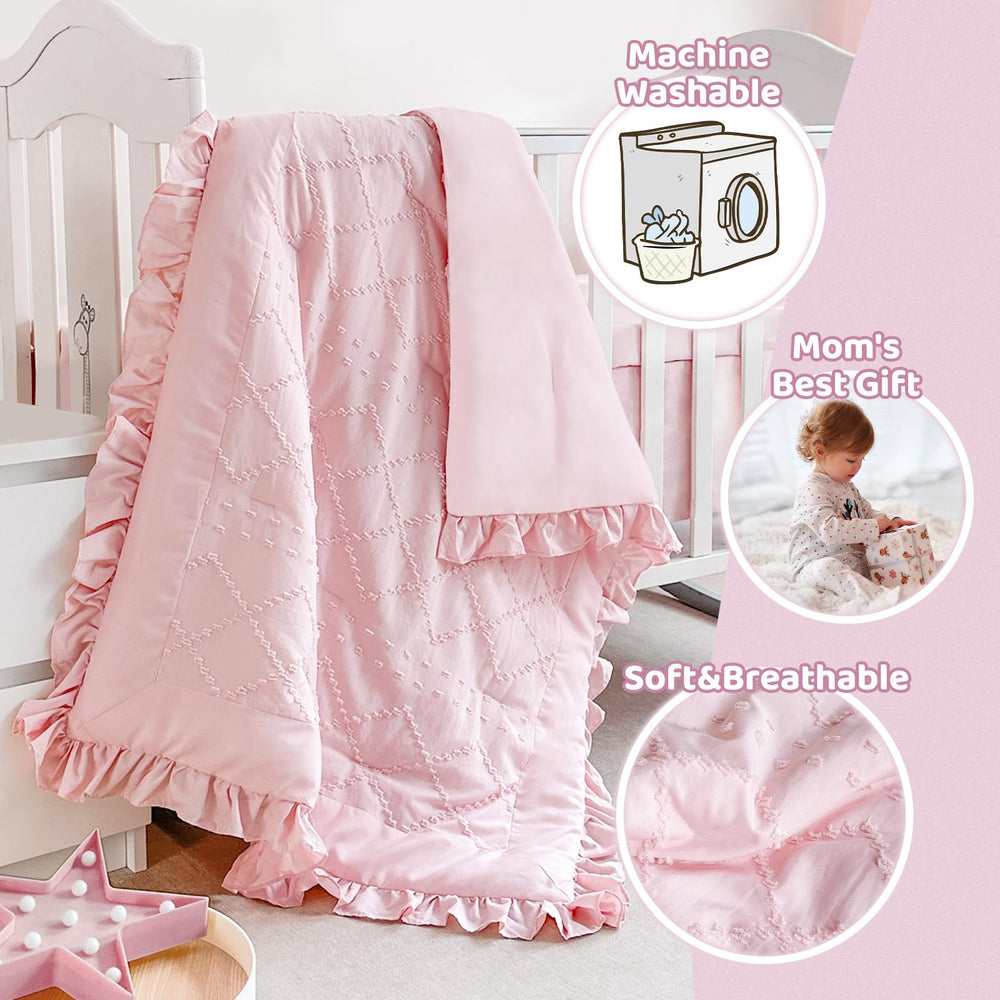 Wowelife crib skirt detail highlighting tidy pleats and pink color