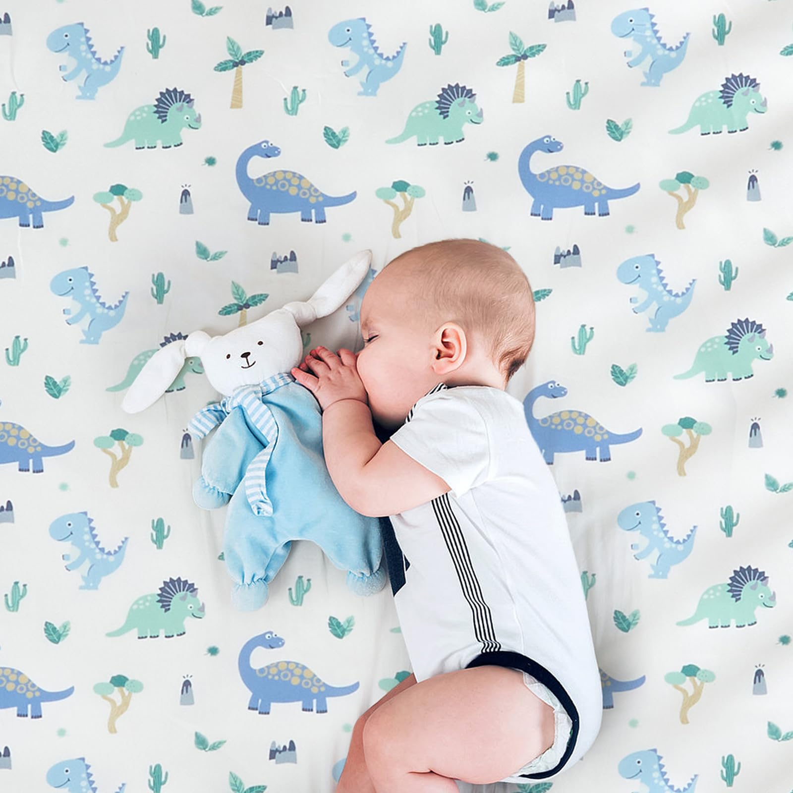 Wowelife Dinosaur crib bedding in a sunny nursery for nap time.