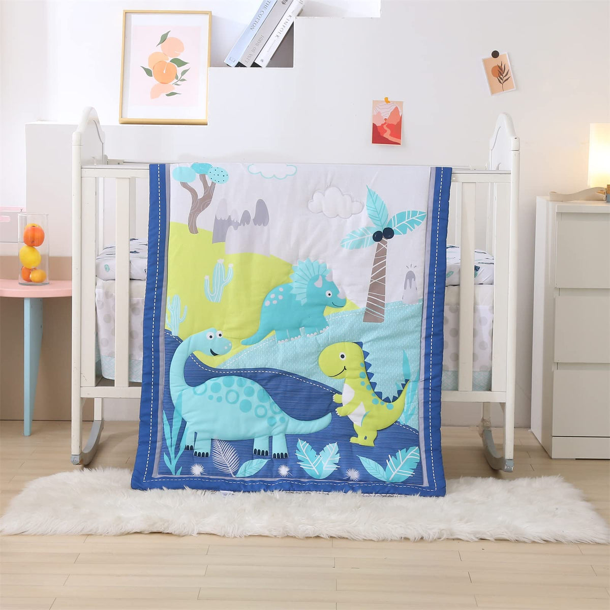 Wowelife dinosaur crib bedding set packaging shows 3-piece layout for nursery setup.