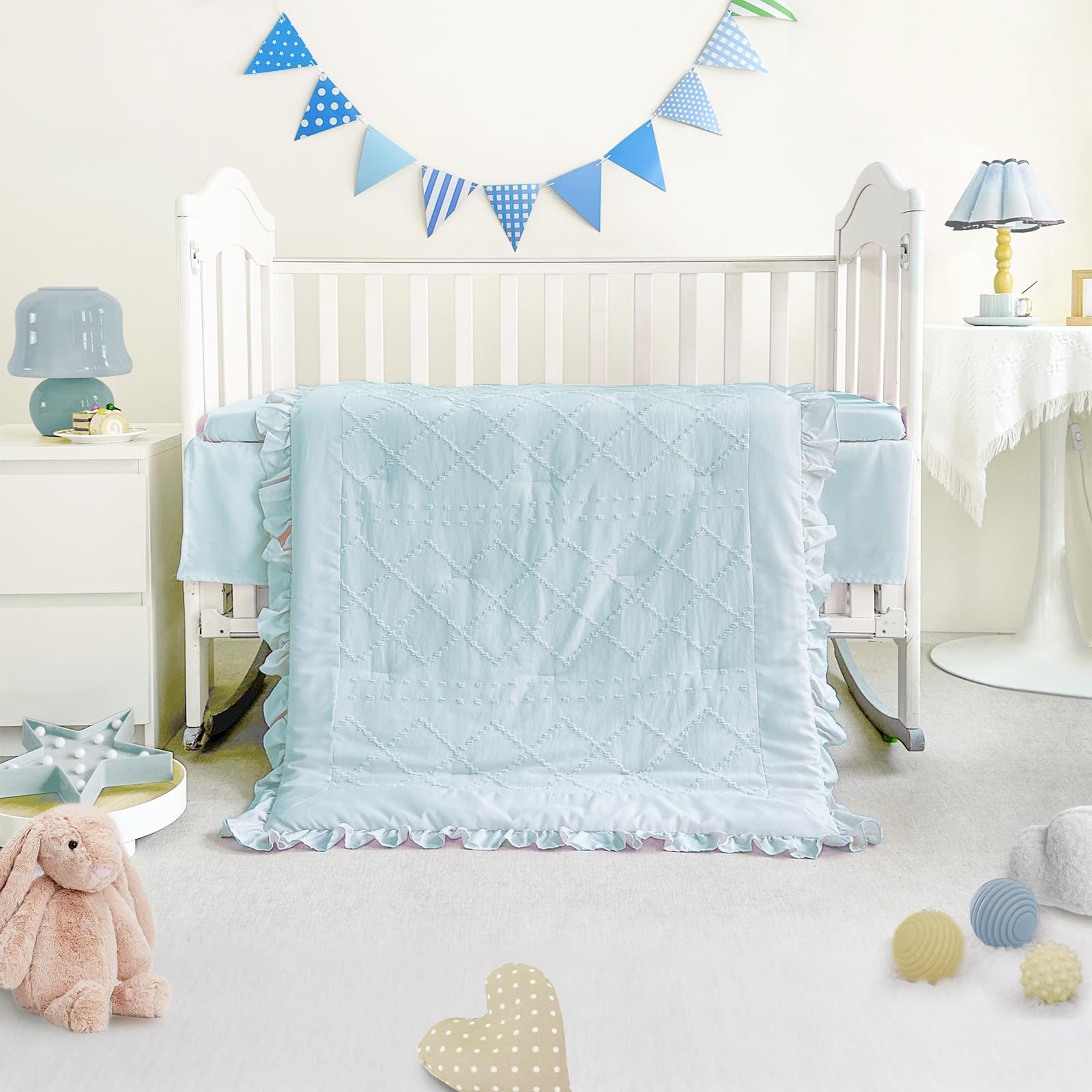 Wowelife mini crib bedding blue sheet close-up highlighting elastic fit for secure placement