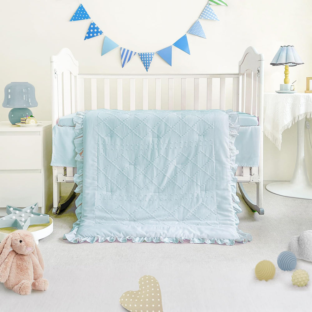 Wowelife mini crib bedding blue sheet close-up highlighting elastic fit for secure placement