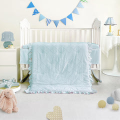 Wowelife mini crib bedding blue sheet close-up highlighting elastic fit for secure placement