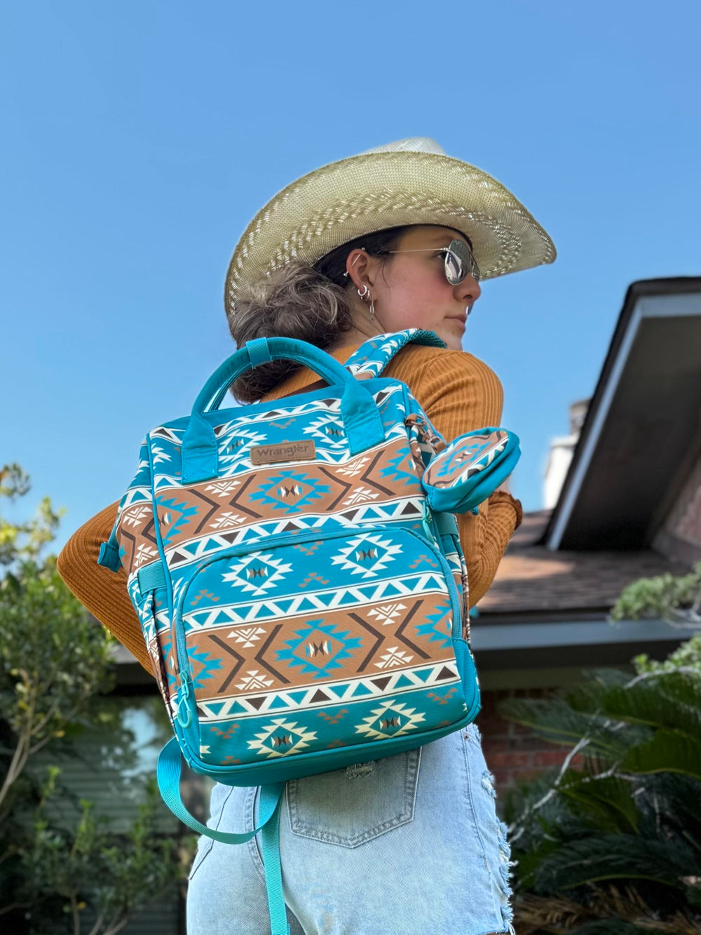 Wrangler Aztec Backpack side view with stroller straps for hands-free mobility.