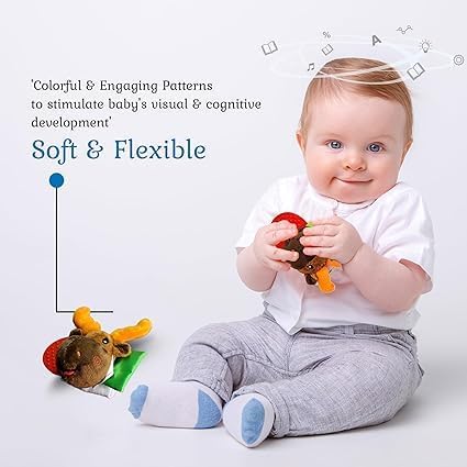 Wristy Buddy elephant teether sitting on hand for easy reach and grip.
