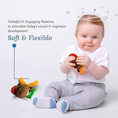Wristy Buddy elephant teether sitting on hand for easy reach and grip.