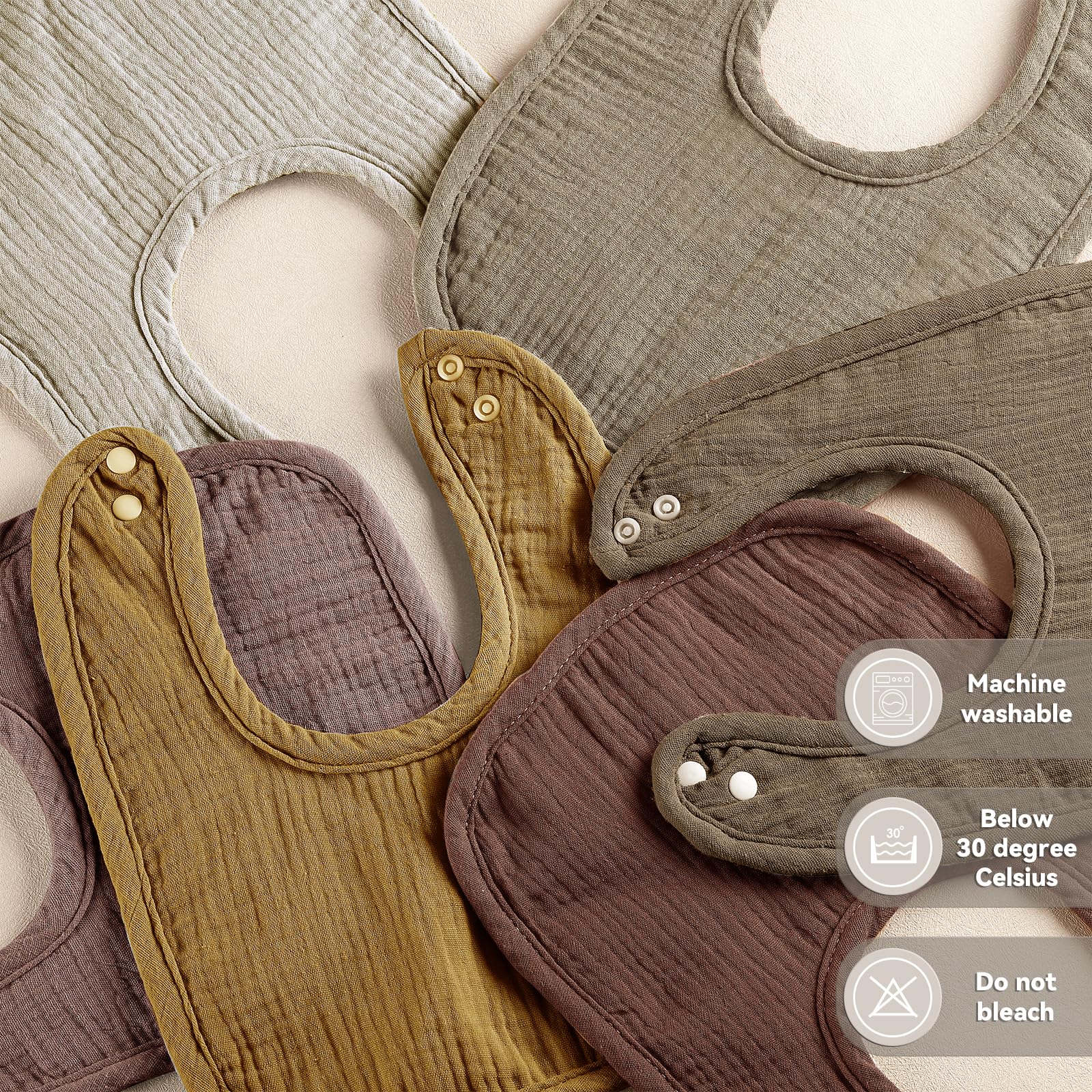 Wrrernsin Muslin Baby Bib close-up of adjustable snaps for a growing baby