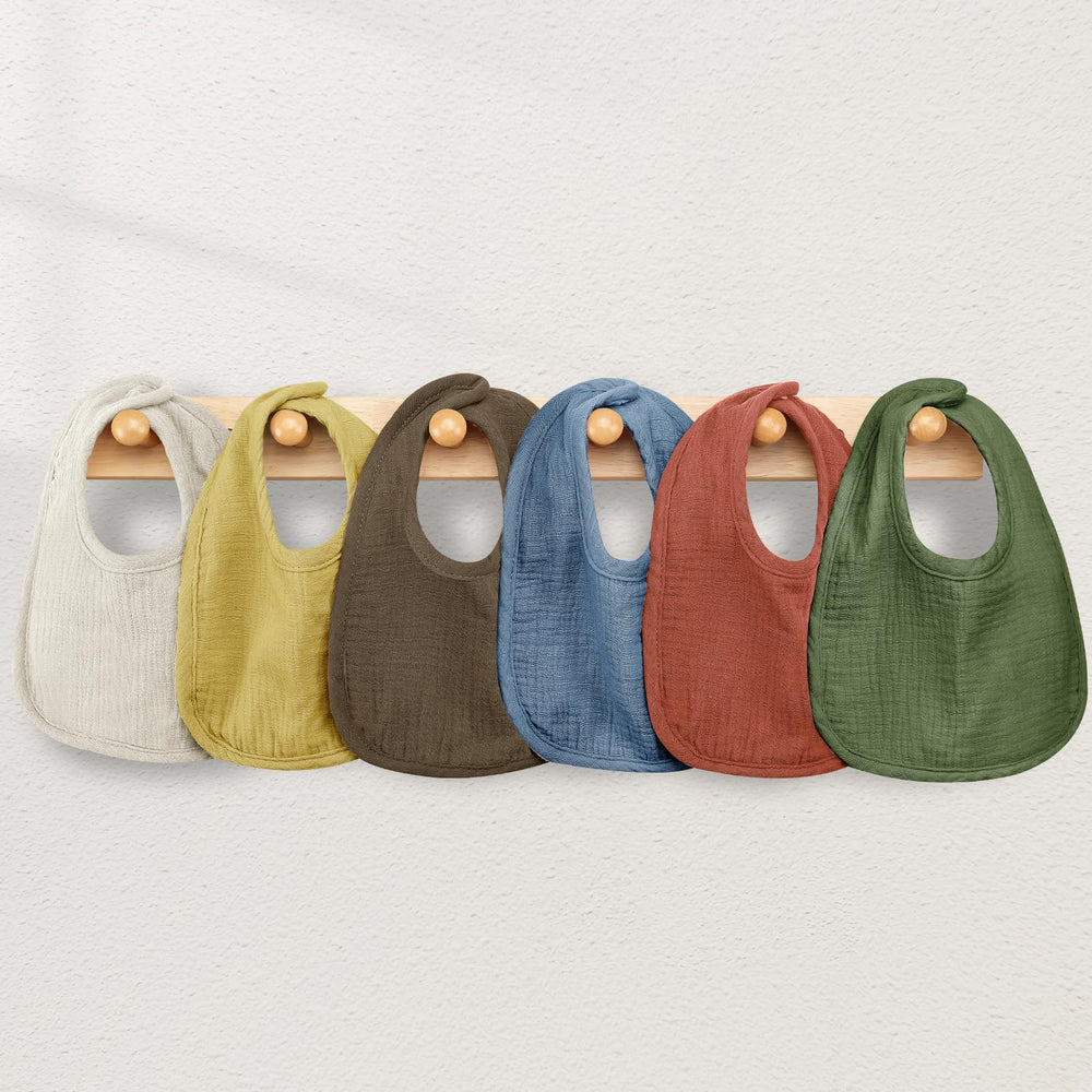 Wrrernsin Muslin Baby Bibs being hand- or machine-washed for easy care.
