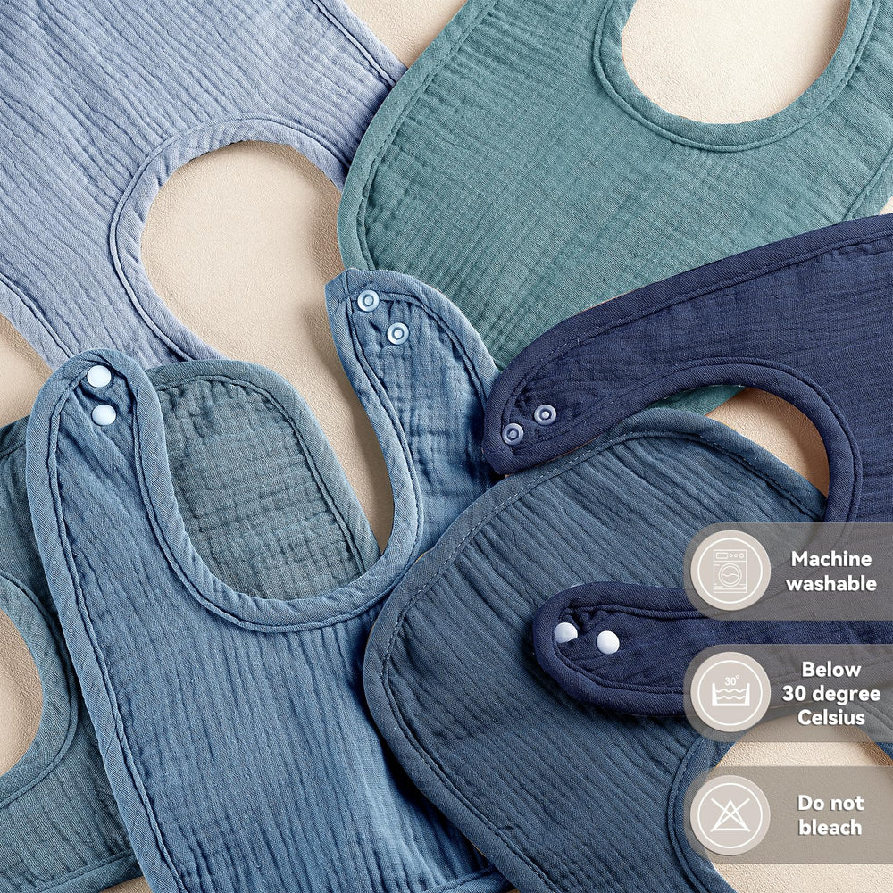 Wrrernsin Muslin Baby Bibs in use for drooling, teething, and messy meals on the go.