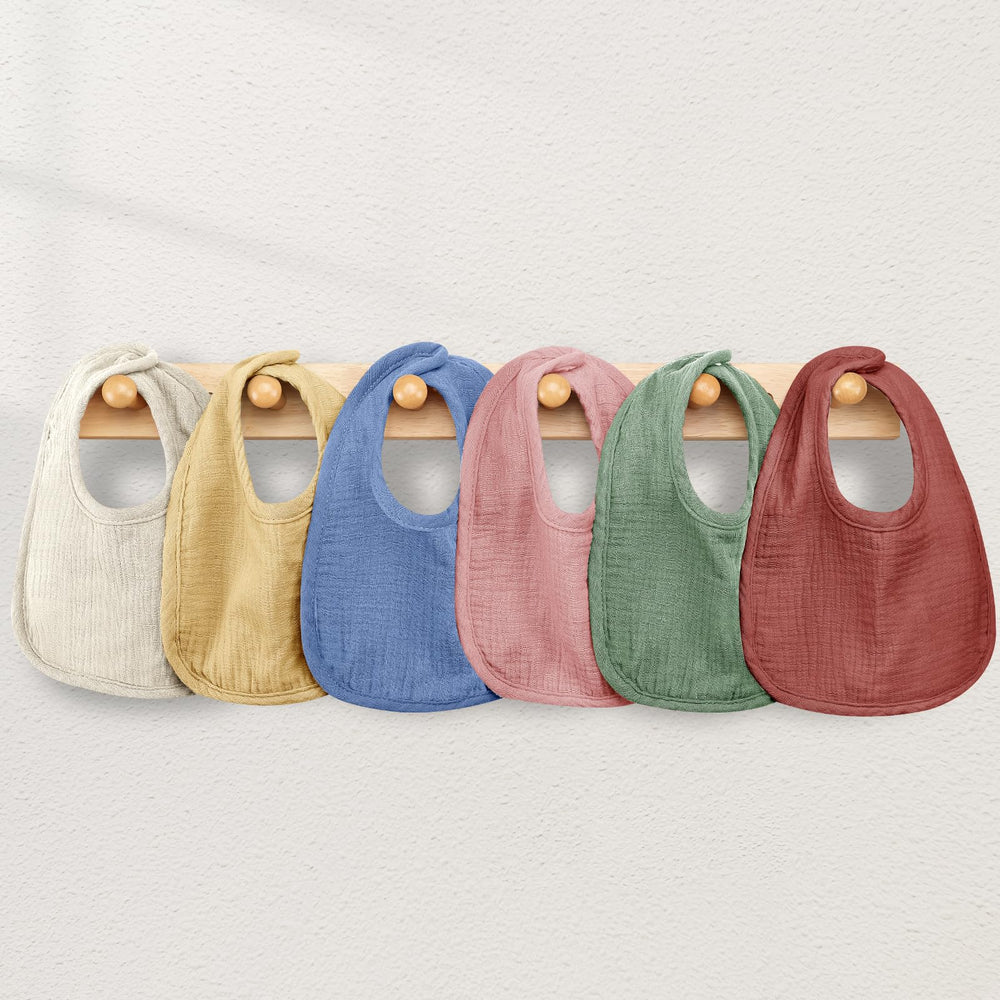 Wrrernsin bibs being washed or packed, highlighting machine-washable convenience