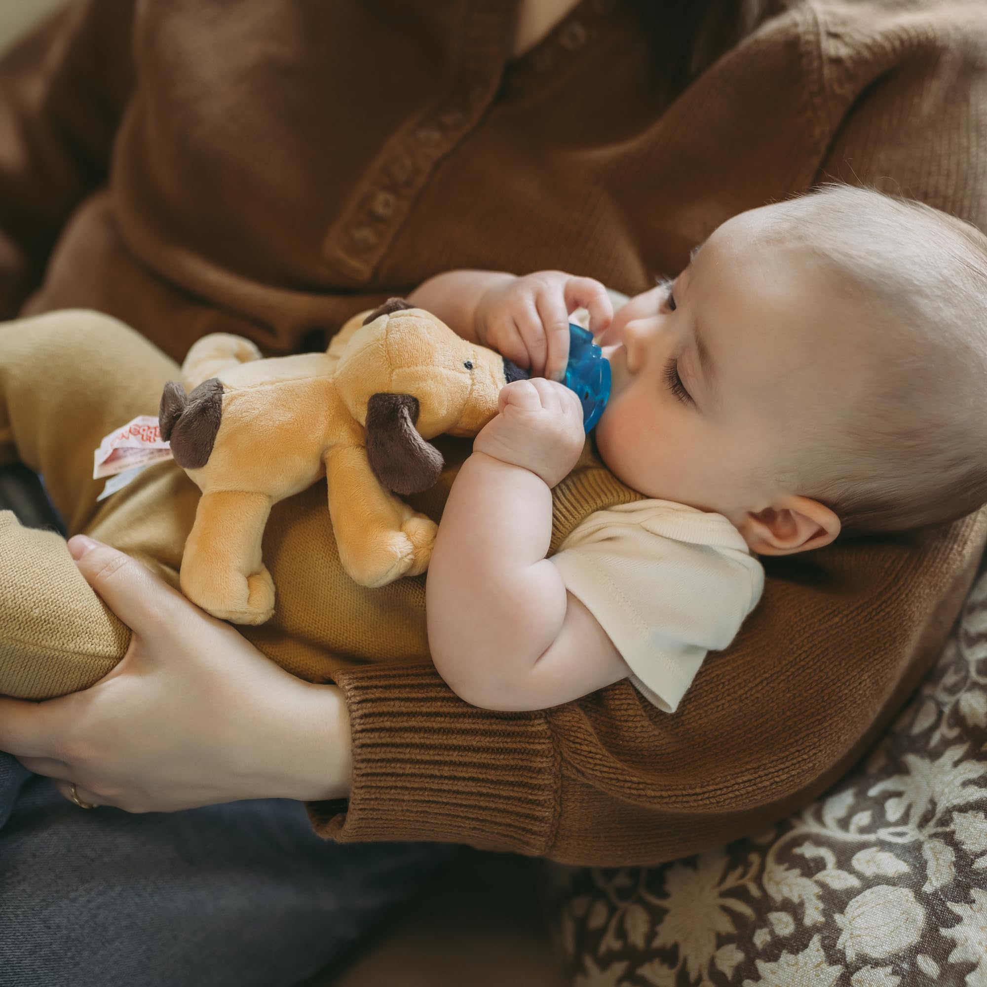 WubbaNub Brown Puppy Lovey pairing enhances comfort during snuggle time.
