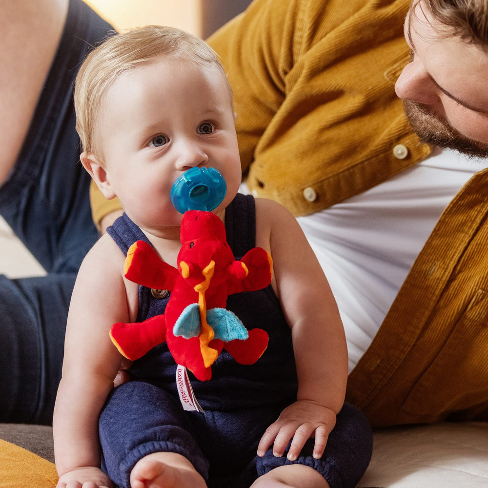 WubbaNub Red Dragon baby holding pacifier for calm moments