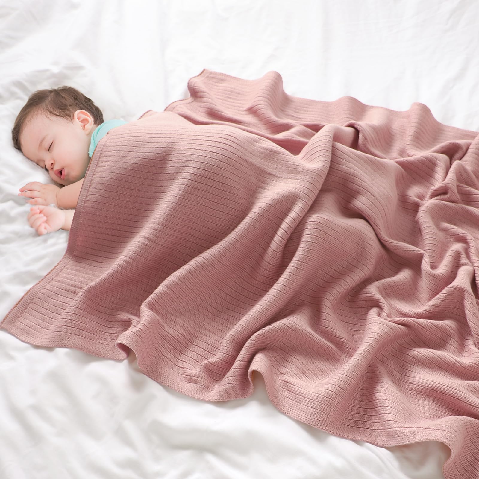 Wugugu baby blanket in crib demonstrates soft fabric for nap time.