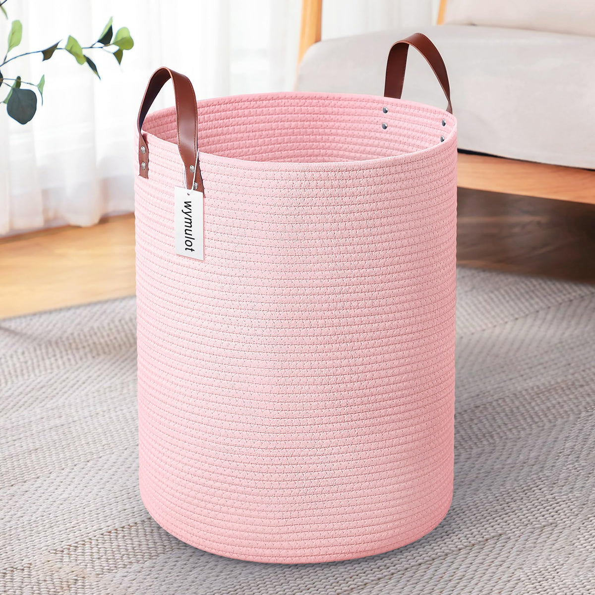 Wymulot pink rope basket front view with leather handles for easy transport.