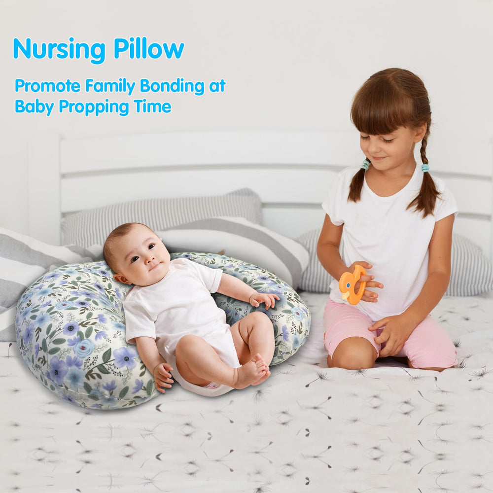 X-vesolje nursing pillow shown propping baby during feeding sessions
