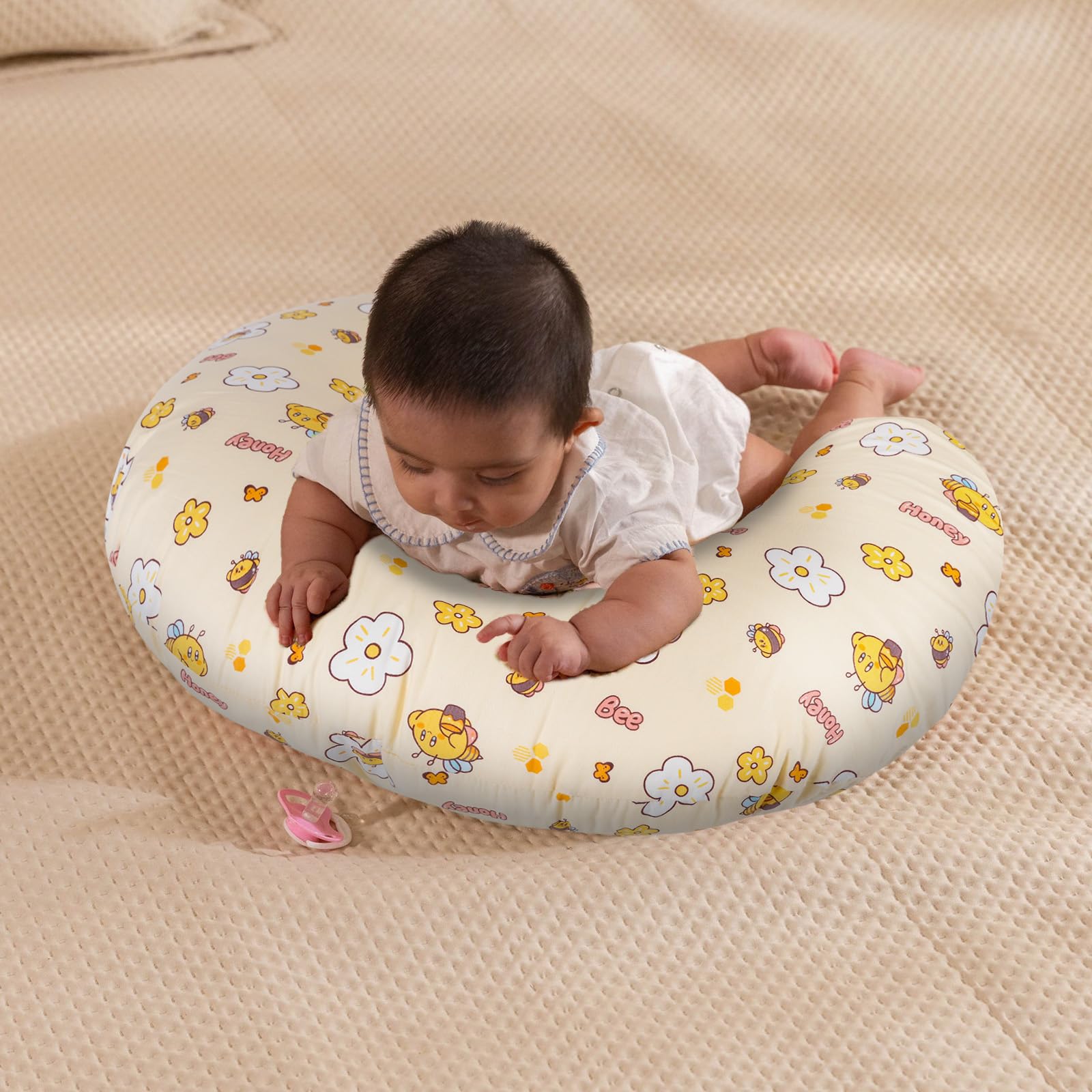 X-vesolje pillow supports baby during propping and tummy time
