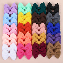 XIMA Puff fabric hair bows for baby-pigtails with velvet inner clips provide gentle, slip-free grip.