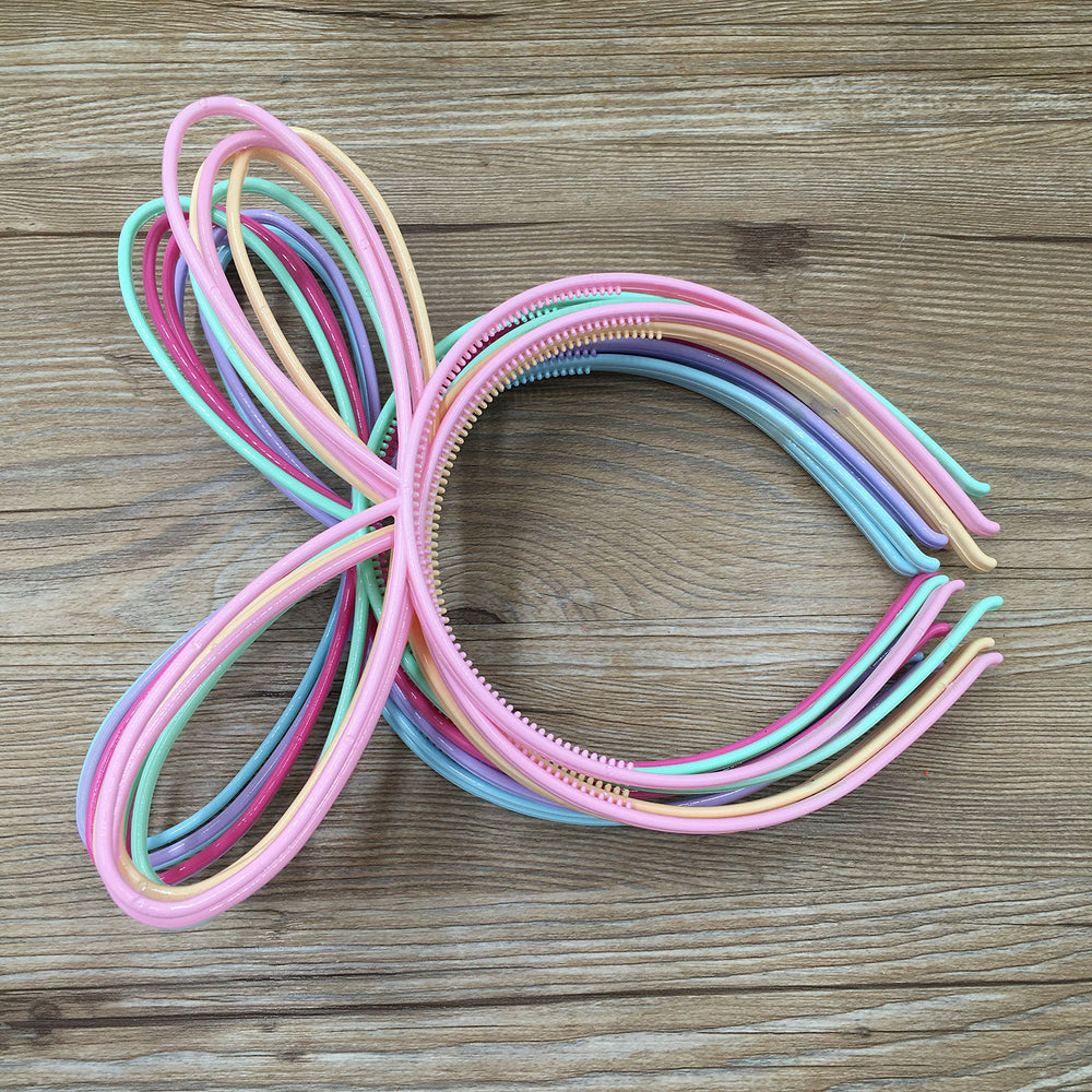 XIMA rabbit-ear headbands on display in a 12-pack.