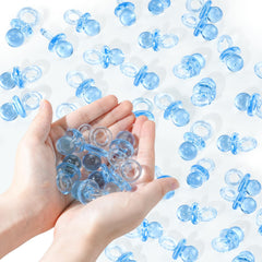 XINHUIDALSQ 36 acrylic pacifiers laid as blue table scatter for baby shower decor