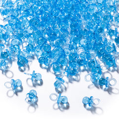 XINHUIDALSQ blue mini acrylic pacifiers scattered on a table for party decor