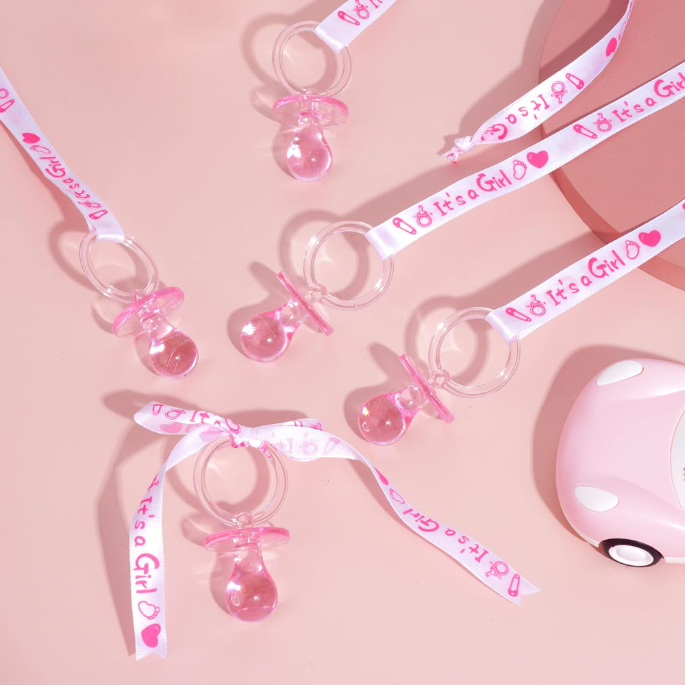 XINHUIDALSQ gender reveal party-scatter prop using pacifier necklaces.