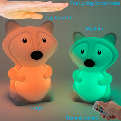Xinjinhju fox night light side view highlights compact presence beside a child’s pillow.