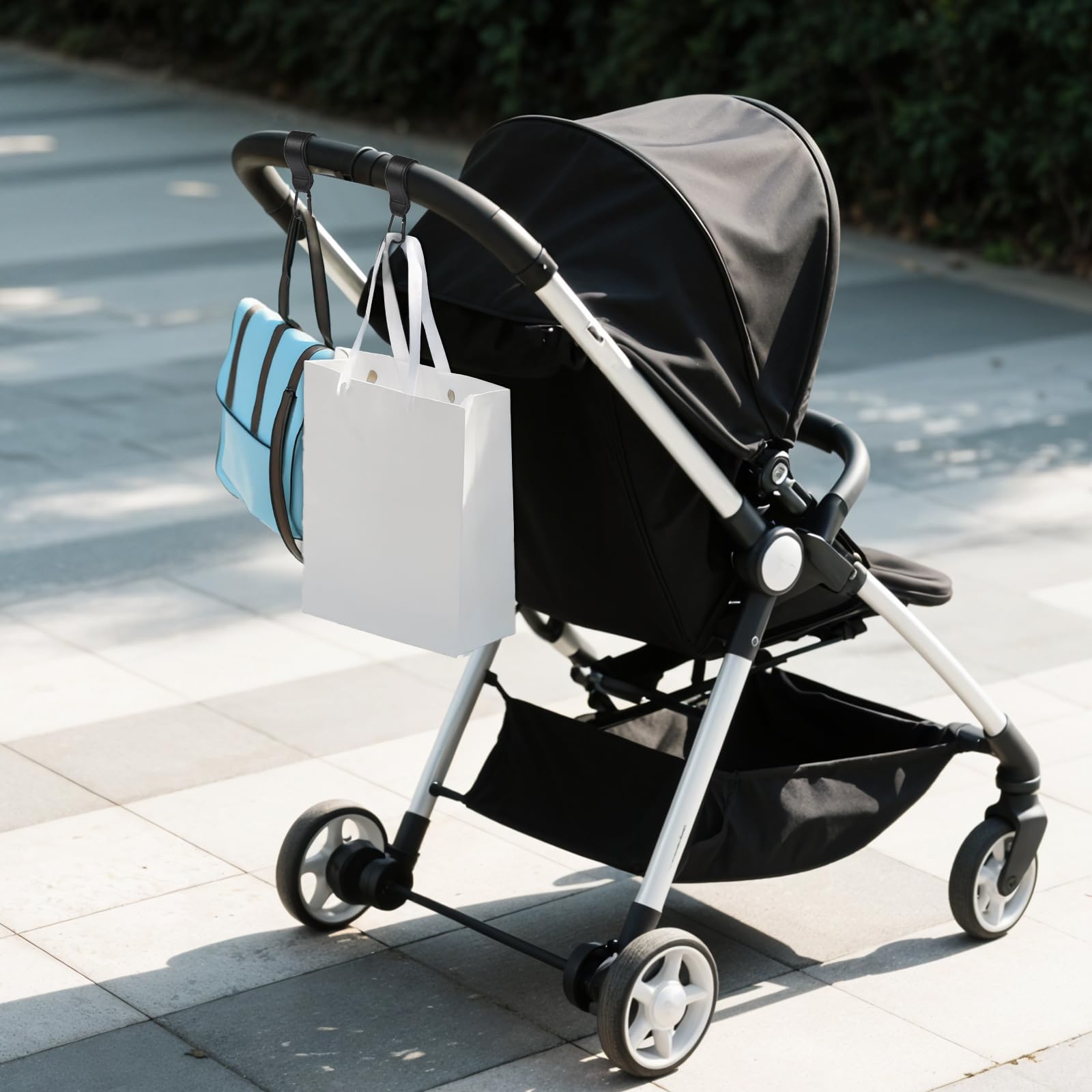 Xinjoduz stroller hook in-use on shopping cart for hands-free bags.
