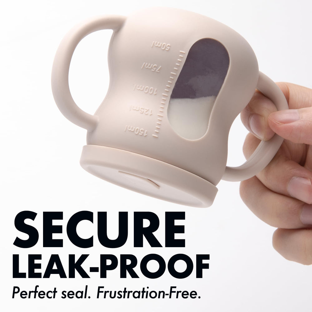 XPECIAL baby training cup beige see-through body for quick cleanliness checks.