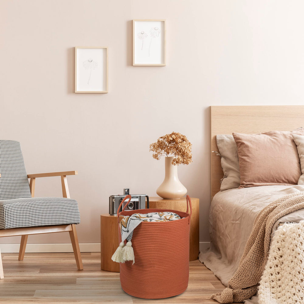 XUANGUO decorative rope basket in a bedroom setup for organization.